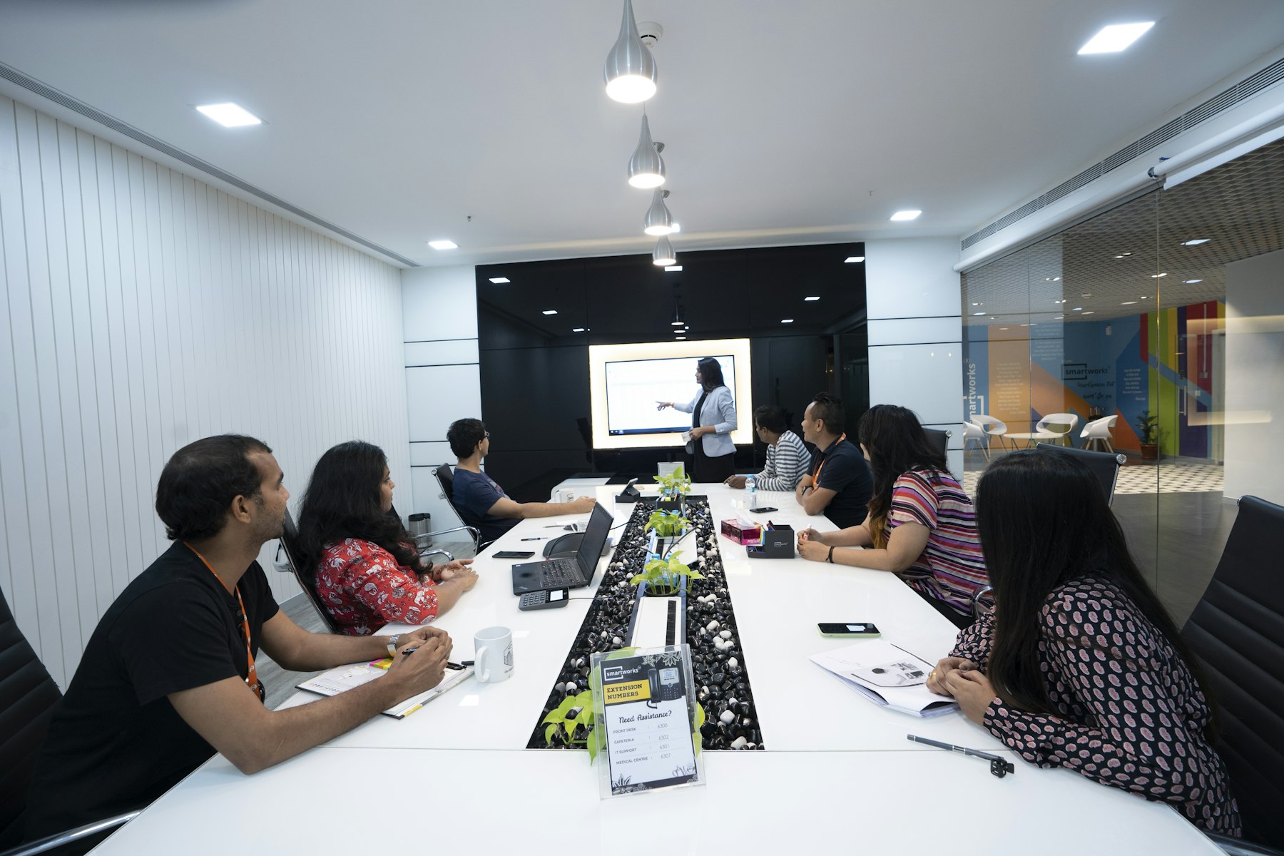 A trainer leading an AI session for a corporate team